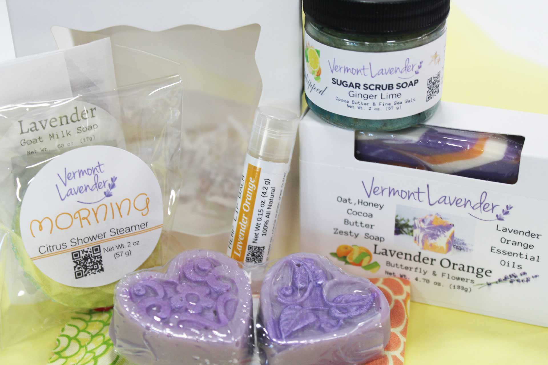 Collection of Vermont Lavender products including soap, scrub, and shower steamer on a white background.