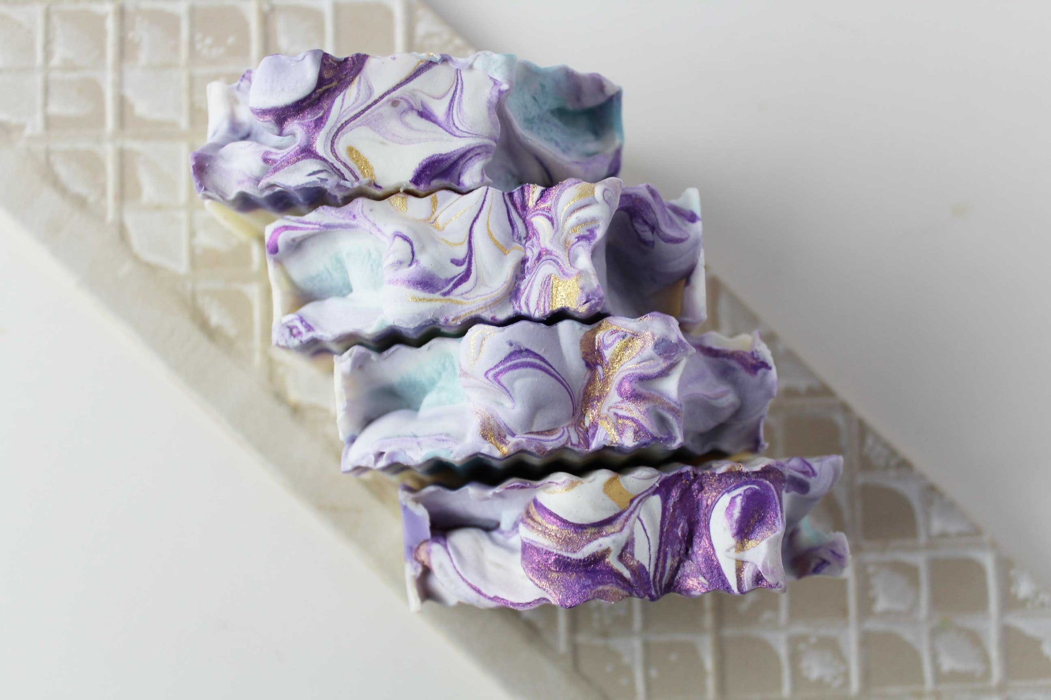 Lavender linen essential oil soap bar daisy embed top view