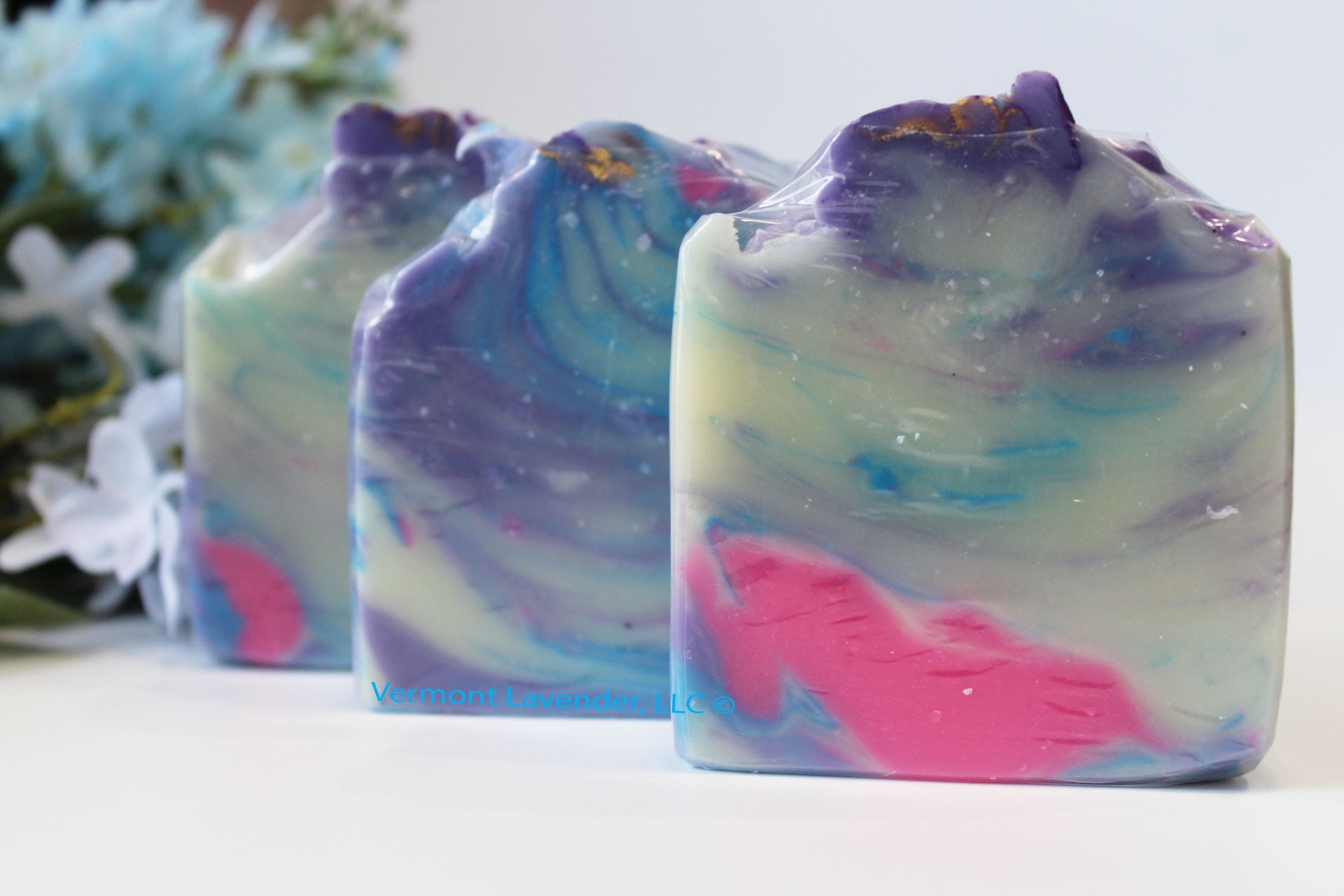 lilies and lilac cold process soap bar by Vermont Lavender with pink blue cream swirl colors front view