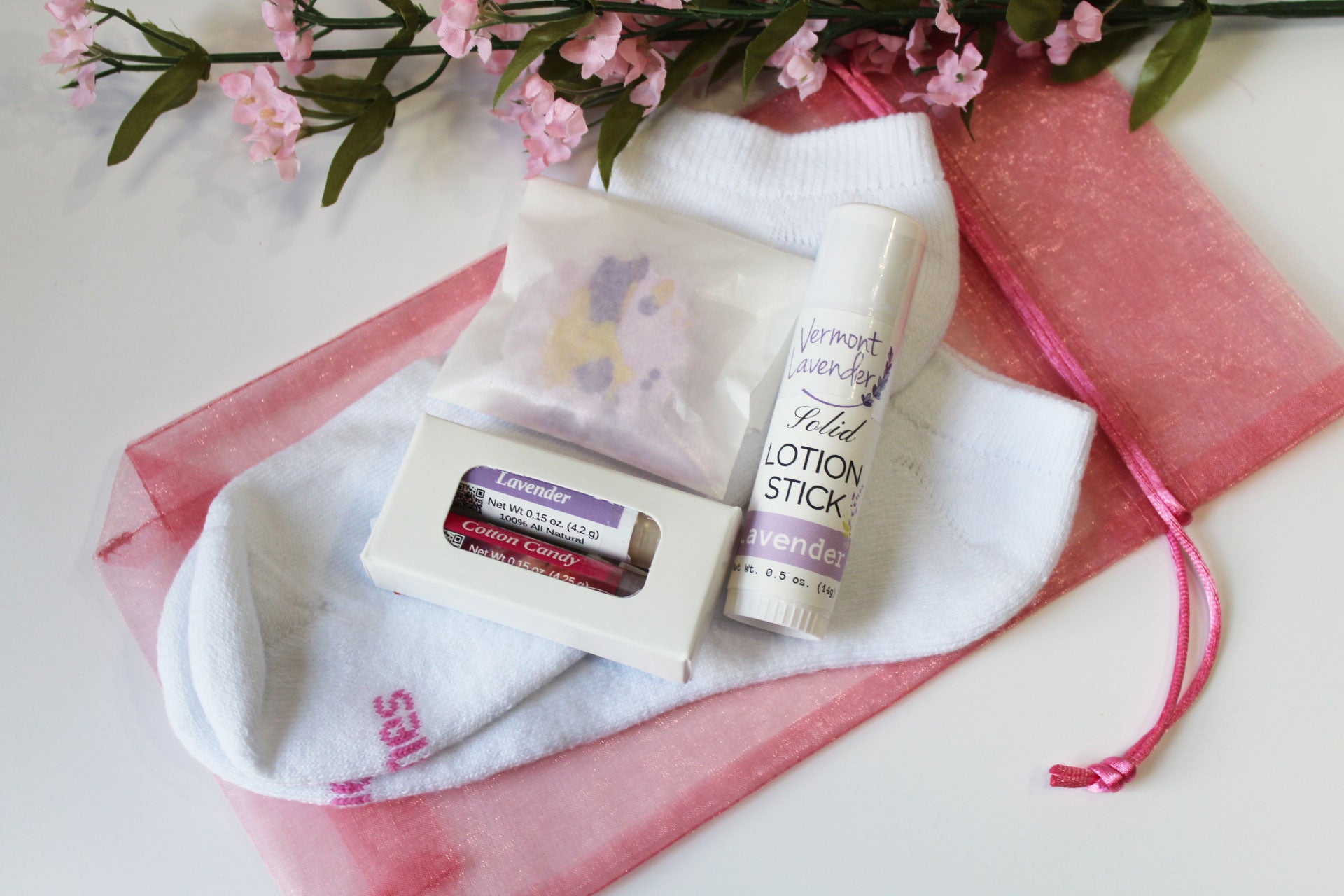 One pair of comfortable socks for your feet - sock variety varies from photo lavender lotion stick lip balms and lavender shower steamer