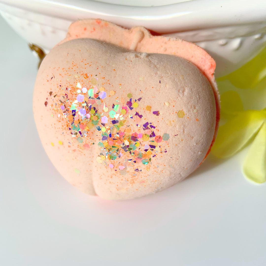 peach shaped bath bomb made with buttermilk and calamine powder with eco biodegradable glitter on top by Vermont Lavender