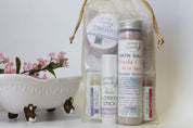Treat someone special or yourself to a relaxing at-home spa experience with this beautifully packaged Wild Rose Bath Spa Gift Set. this photo: bath salts 4 oz, lavender and raspberry lip balms, DREAM shower steamer, lavender solid lotion stick