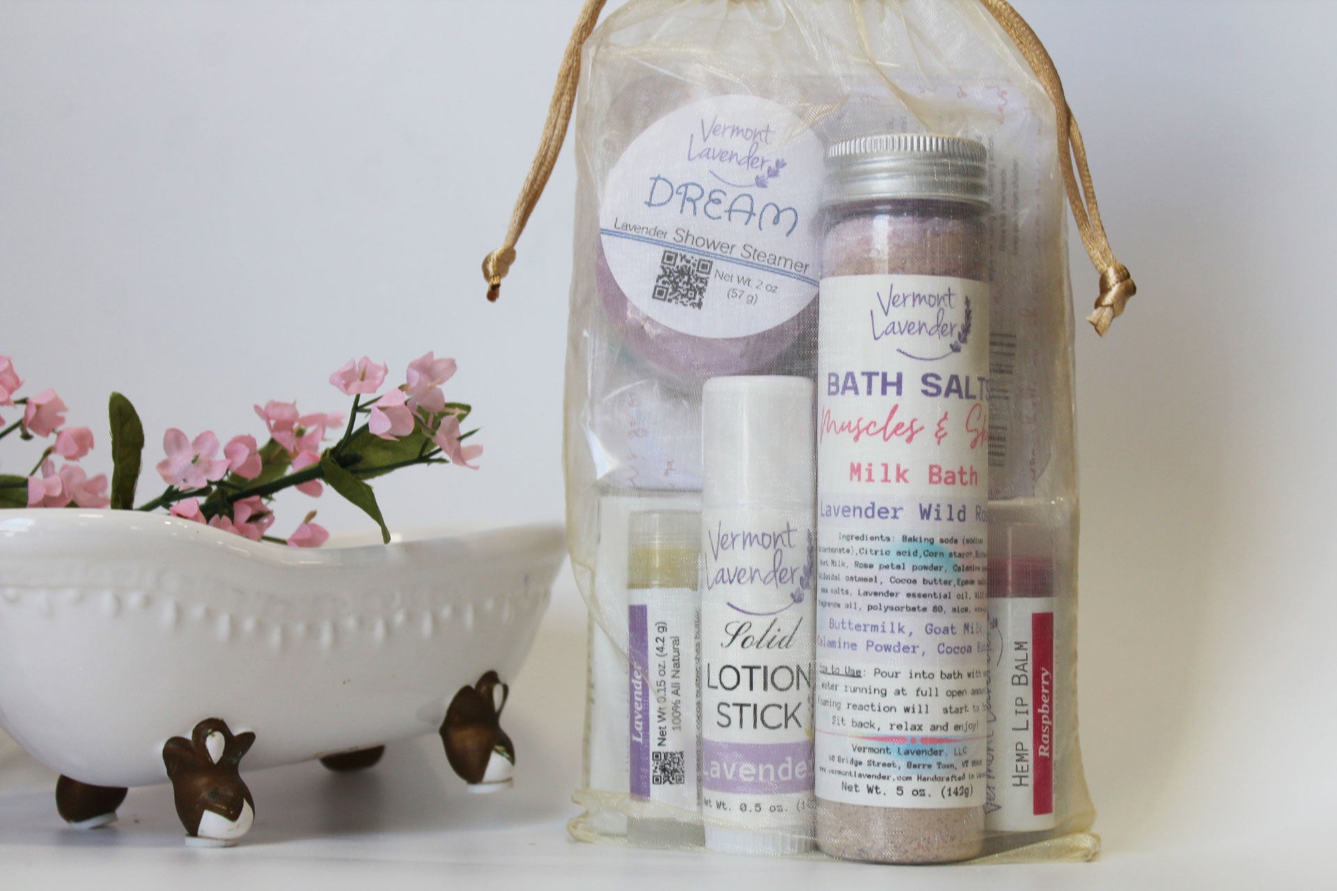 Treat someone special or yourself to a relaxing at-home spa experience with this beautifully packaged Wild Rose Bath Spa Gift Set. this photo: bath salts 4 oz, lavender and raspberry lip balms, DREAM shower steamer, lavender solid lotion stick