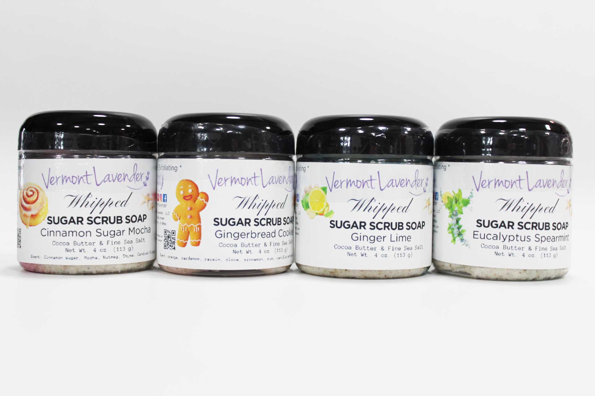 Four jars of Vermont Lavender Whipped Sugar Scrub Soap on a white background