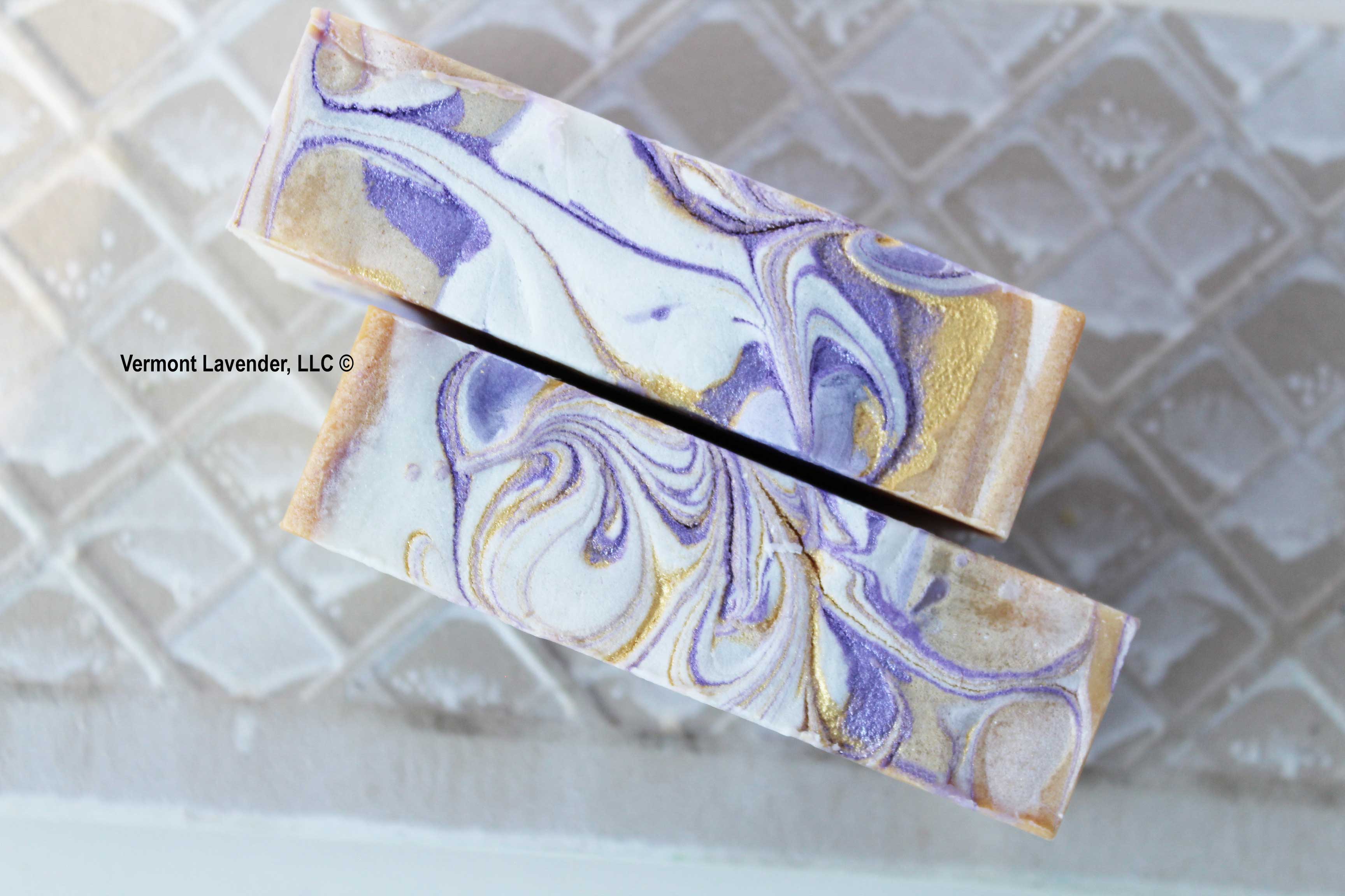 top view of lemon lavender soap with purple and gold swirls